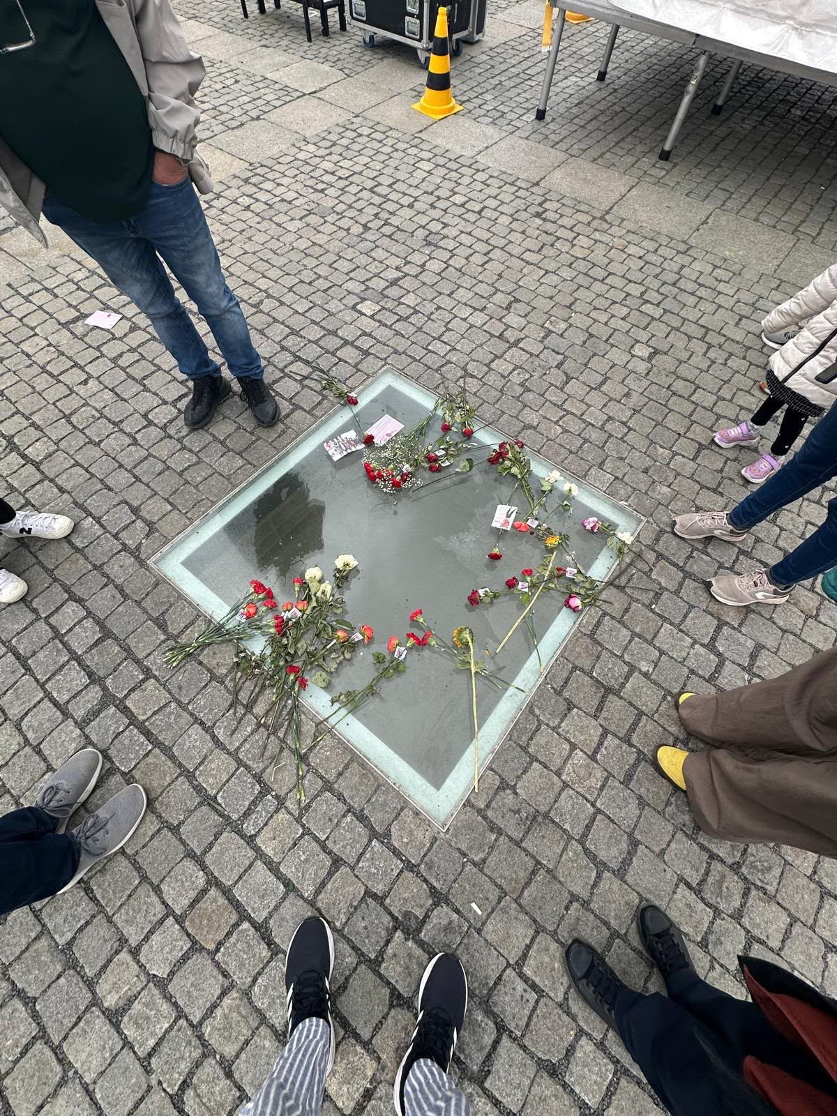 Flowers on the glass above Bebelplatz’s Empty Library memorial